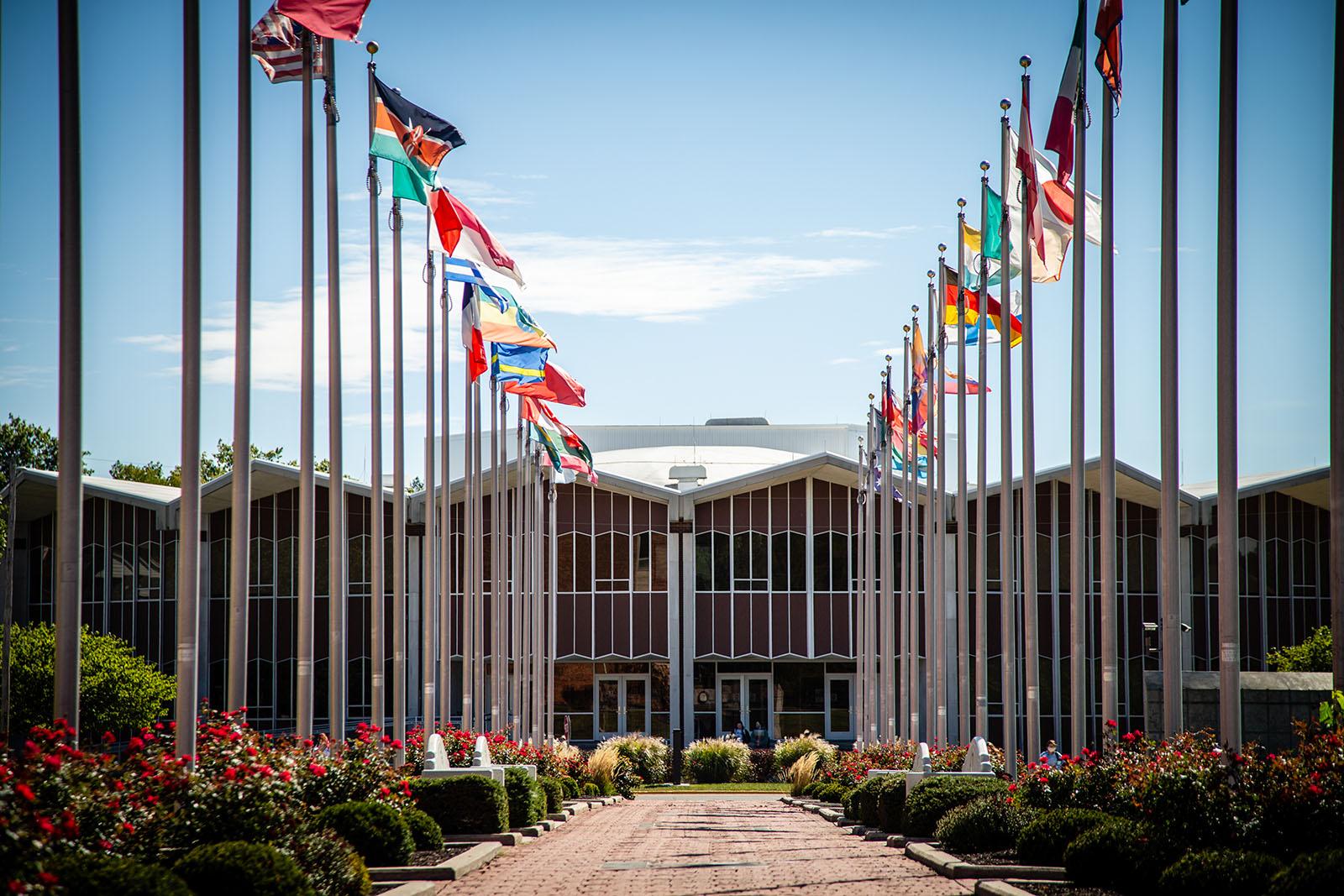 The 乔伊斯 and Harvey White 国际广场, which displays 54 flag as well as five clocks on the “Friends Wall & 世界时钟,” stretches approximately 300 feet from West Fourth Street on the southern edge of campus to the center of the campus.