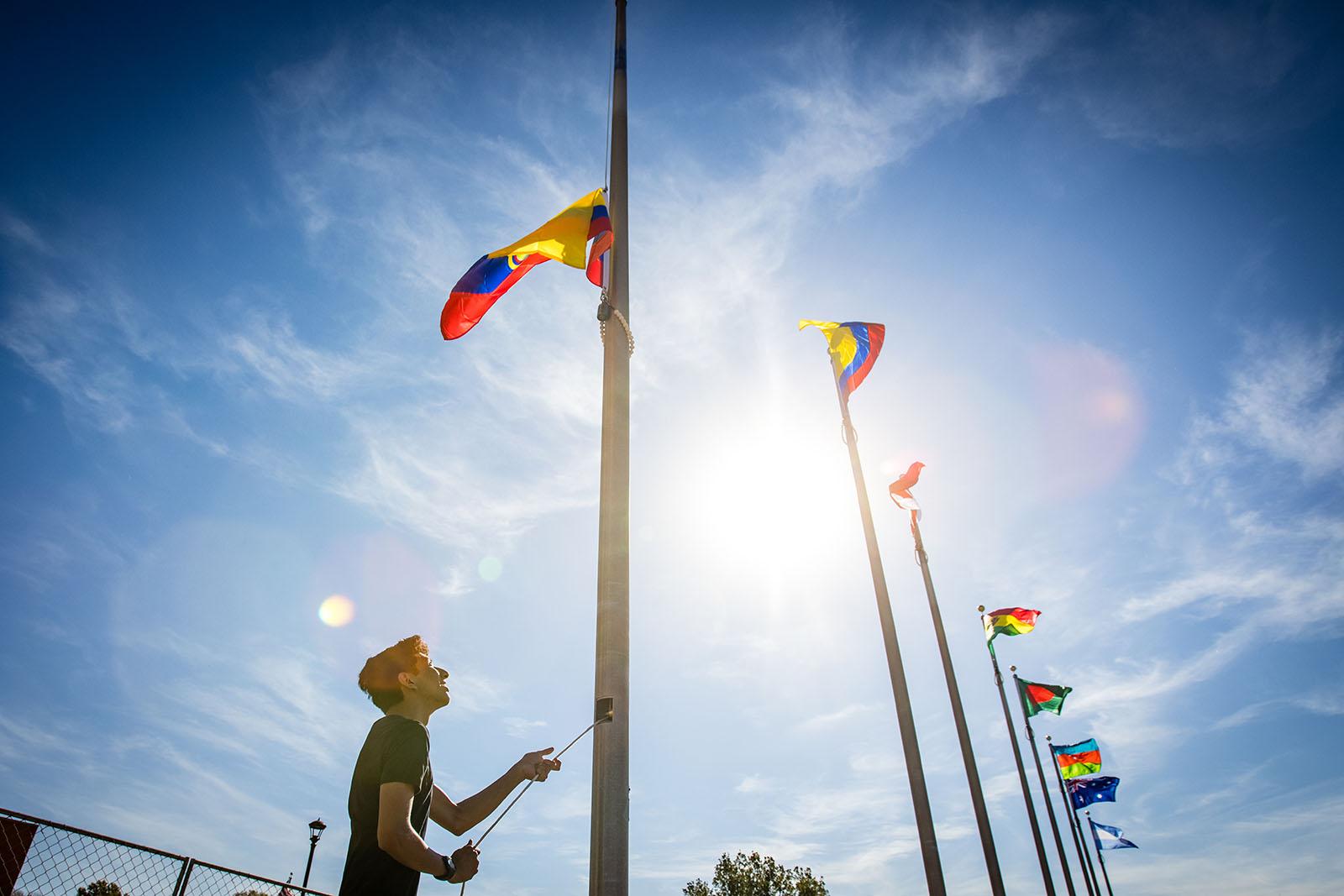 Northwest international students participate in a flag-raising ceremony during Homecoming activities each fall to celebrate their homelands and cultures as well the University’s diversity. 